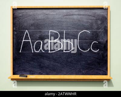 School blackboard with 'ABC' written on it in upper case and lower case letters Stock Photo