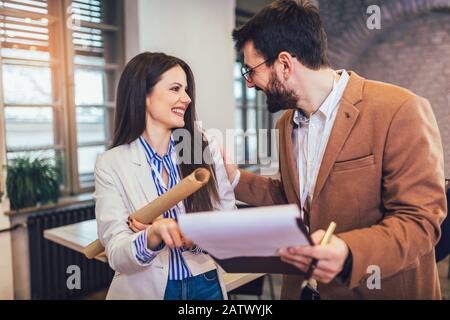 Two designers working together on new project in modern office. Stock Photo