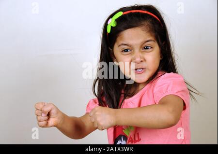 Mumbai, Maharashtra, India- Asia, Dec. 29, 2014 - Indian little cute girl Female boxer in a self-defense posture. Stock Photo