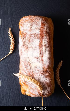 Fresh crusty loaf of artisanal homemade bread baked in a Lodge Dutch oven  cast iron pot in an doven at high temperatures Stock Photo - Alamy