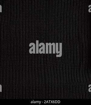 black knitted fabric, full frame, close up Stock Photo