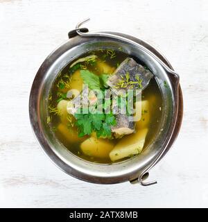 Trout fish soup. Ukrainian cuisine. Top view. Free space for your text. Rustic style. Stock Photo