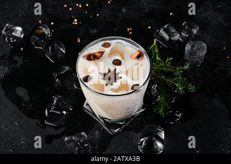 Coffee Cream Liqueur from brandy and whiskey. On the black bar. Stock Photo