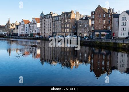 Winter reflections of buildings on The Shore on the Water of Leith in Leith, Edinburgh, Scotland, United Kingdom Stock Photo