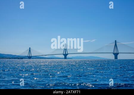 Greece. Bridge Rion Antirion. Three high pylons of the cable-stayed bridge over the Gulf of Corinth in sunny weather Stock Photo