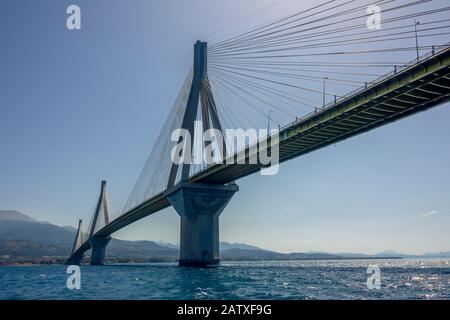 Greece. Bridge Rion Antirion. High pylons of the cable-stayed bridge over the Gulf of Corinth in sunny weather. View from the water level Stock Photo