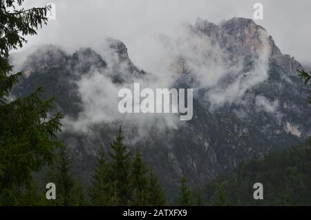 After the rain clouds of steam envelop the mountain peaks Stock Photo