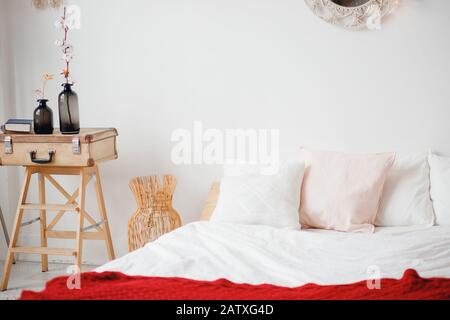 Minimalism Scandinavian style bedroom with white walls laundry basket Stock Photo