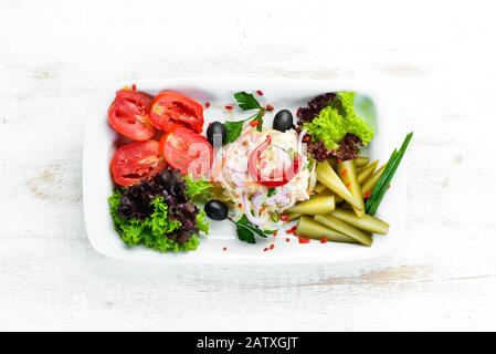 Assorted pickled vegetables on a plate. Ukrainian cuisine. Restaurant dishes. Top view. Free space for your text. Stock Photo