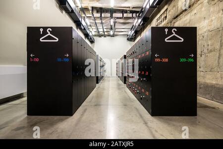 Contemporary storage lockers. Wide angle view of modern storage lockers in an anonymous industrial setting. Tate Modern, London. Stock Photo