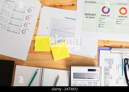 Top view of business charts or graphs on desk. Stock Photo