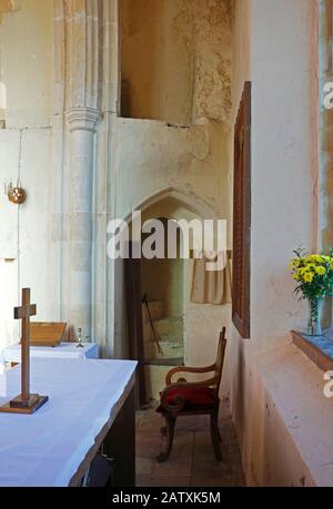 A view of the rood loft stairs in the reduced chancel in the parish Church of St Peter and St Paul at Honing, Norfolk, England, UK, Europe. Stock Photo