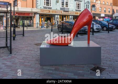 Giant fibre glass high heeled shoe, part of a Shoe Sculpture Trail to celebrate the town's rich shoe making heritage; Northampton, UK Stock Photo