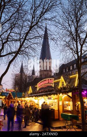 Christmas market, in the back Bonn Cathedral, Muensterplatz, Bonn, North Rhine-Westphalia, Germany Stock Photo