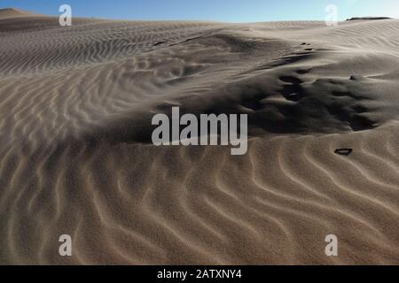 Sand ripples and wind sculptured patterns, shapes and textures in the towering sand dunes of Sardinia Bay, Port Elizabeth, Eastern Cape, South Africa Stock Photo