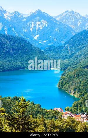 Landscape of Alpine mountains, Germany. Beautiful scenic view of nature from above. Nice landscape with Alpsee lake and Hohenschwangau village in fore Stock Photo