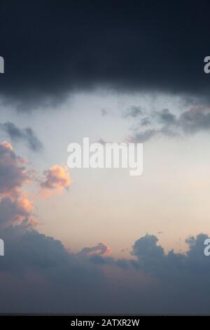 Clouds background; Dramatic sky with clouds at dusk, - useful for abstracts and backgrounds, Maldives, Asia Stock Photo