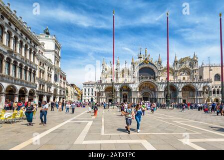 Venice, Italy - May 19, 2017: Tourists are walking in the Piazza San Marco (St. Mark's Square). This is the main square of Venice. Stock Photo