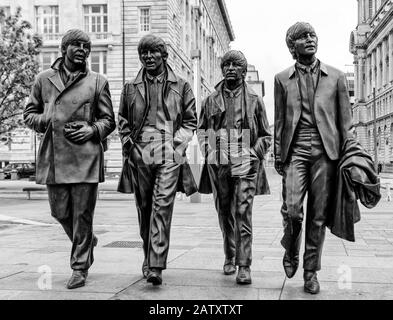 Bronze Statues of The Beatles located on Pier Head, They were created by Andy Edwards and unveiled in December 2015 Stock Photo