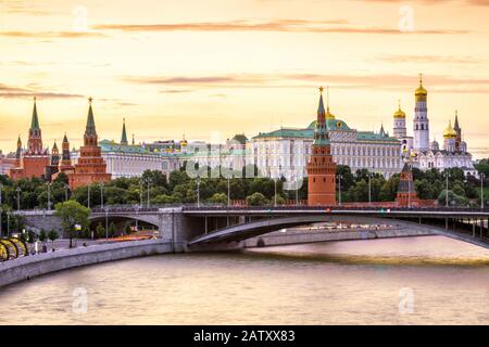 Moscow Kremlin at Moskva River, Russia. Panorama of the Moscow old city at sunset. Scenic warm view of the ancient Moscow Kremlin in summer evening. B Stock Photo