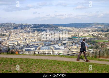 People taking advantage of the high vantage point view are pictured in Alexandra Park looking down at the city of Bath. Bath Somerset England uk Stock Photo