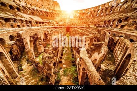 Inside the Colosseum or Coliseum in summer, Rome, Italy. Colosseum is the main travel attraction of Roma. Ruins of the Colosseum arena. Panoramic view Stock Photo