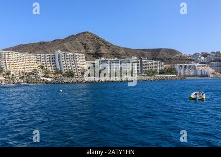 Hotel Radisson Blue and apartment buildings in Anfi del Mar seen from the sea, south coast, Gran Canaria, Canary Islands, Spain Stock Photo