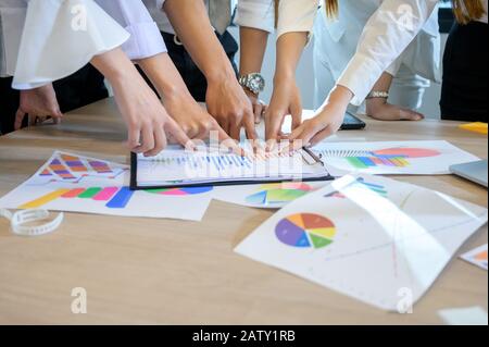Business people are meeting and graphing business growth on a desk Stock Photo