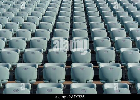 Empty Chairs In Stadium. Empty Dark Blue Chairs At The Football Stadium Stock Photo