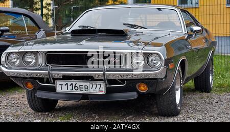 exhibition of old Muscle car, in Russia on the street, people watching Stock Photo
