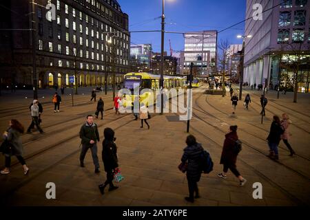 Manchester city centre Peters Square Metrolink tram halt crossing exchange passing the historic stone cross Stock Photo