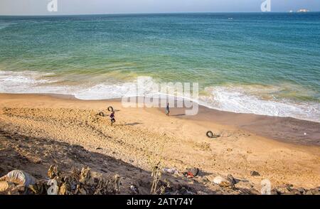 Dakar, Senegal- April 24 2019: Men playing football on the beach near Dakar city in Africa. Stock Photo