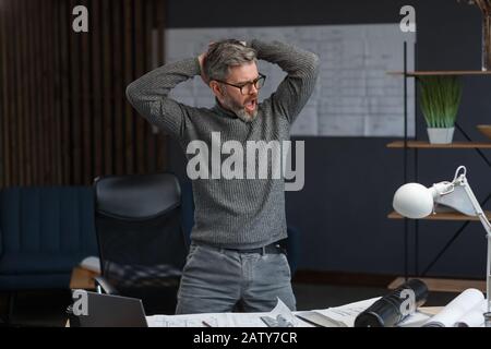 The best day ever. Handsome man dancing and expressing positivity. Happy businessman got positive news. Victory dance, fast growing company, rewarded, Stock Photo