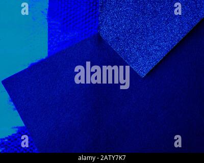 Paper background with paper texture in different blue tones Light blue with deep blue. Geometric sheets of paper. Stock Photo