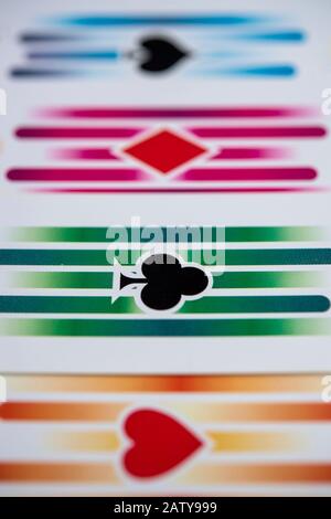 Reverse side of four playing cards showing the four suits Stock Photo