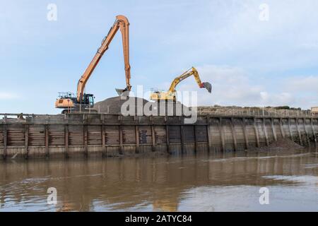 Littlehampton, West Sussex, UK, February 05, 2020. Dredging The River Arun with large excavators and earth moving equipment to help navigation. Stock Photo