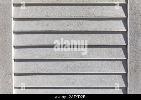 Geometrical pattern and straight lines as part of  an exterior stucco application to a building during construction. Stock Photo
