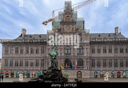 Antwerp / Belgium - October 08 2019: City hall and fountain statue of Silvius Brabo throwing the giant's hand at the Grote markt / Town Square Stock Photo