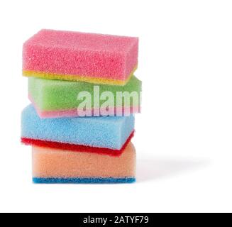 Four multicolored kitchen foam sponges of pastel colors isolated on white background. Sponge for washing dishes and housework. Front view. Stock Photo