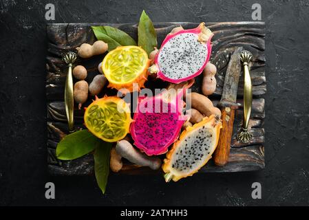 Kiwano and dragon fruit. Tropical Fruits. Top view. Free space for text. Stock Photo