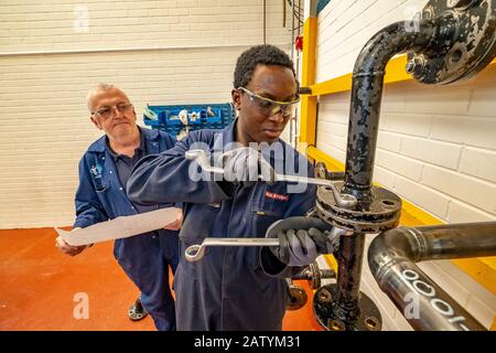 Apprentice engineers training Stock Photo