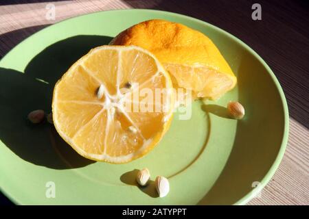 Sliced lemon. Home made lemon slices. Lemon slices on a saucer. Stock Photo