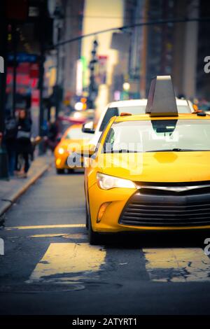 New York City Street scene with iconic yellow taxi cab Stock Photo