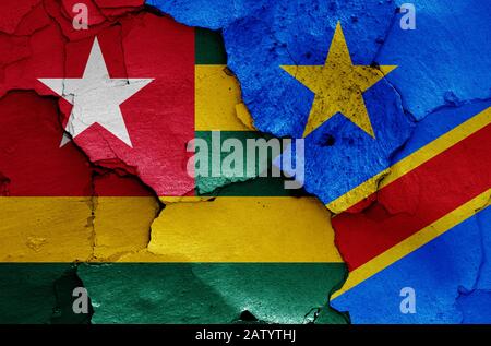 flags of Togo and DR Congo painted on cracked wall Stock Photo