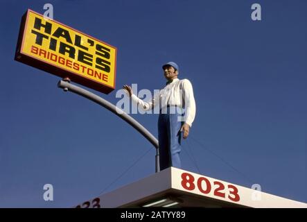 Vintage advertising figure above Hal's Tires shop in Los Angeles, CA. Stock Photo