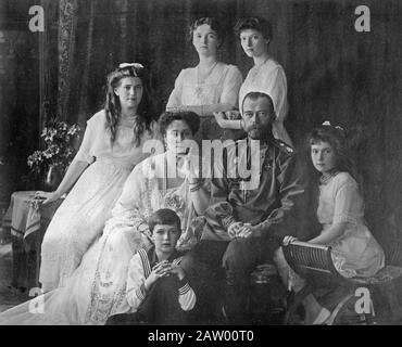 Royal Russian family [1914] - The Romanovs, the last royal family of Russia including: seated (left to right) Marie, Queen Alexandra, Czar Nicholas II, Anastasia, Alexei (front), and standing (left to right), Olga and Tatiana Stock Photo