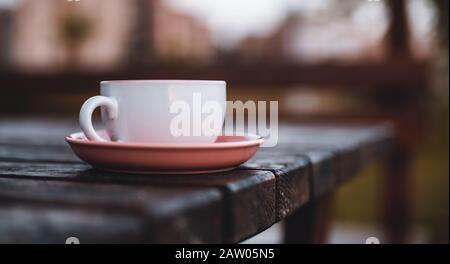 Beautiful pink teacup in on the table. Tea Cup Concept. Stock Photo