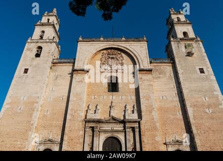 Catedral de San Ildefonso is the main cathedral of Merida, Yucatan, Mexico. This image shows the facade in sunlight against the sky. Stock Photo