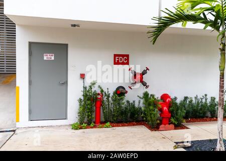 Fire Department Connection on the outside of a commercial building, for supplying emergency water to the building. Stock Photo