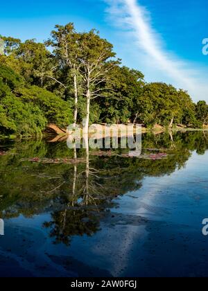 Reflections at the moat at the east gate of Angkor Wat Cambodia Stock Photo